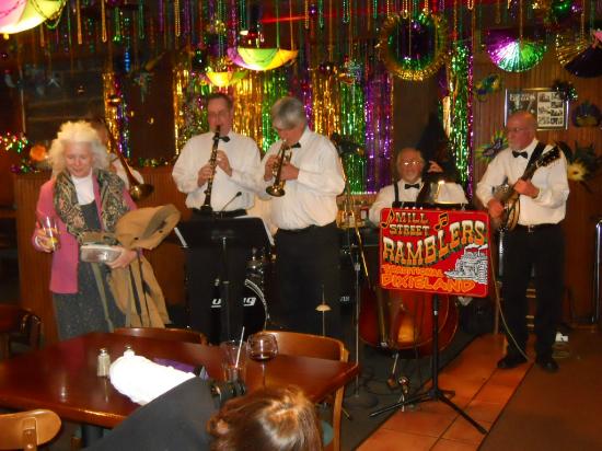 A band of four members playing music in the restaurant