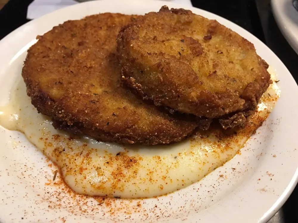 Closeup shot of fried green tomatoes with sauce