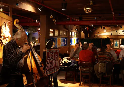 A man playing violin inside the restaurant